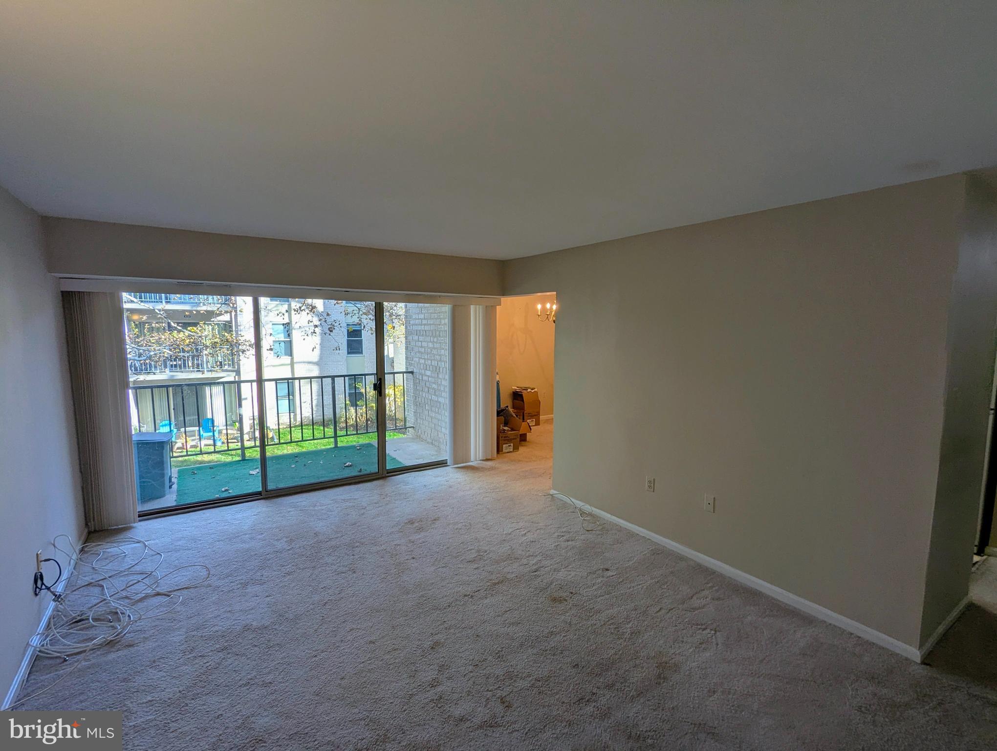 15 Canterbury Square, Unit 202 Alexandria, VA 22304 - Photo 6 of 14 a view of a room with large windows