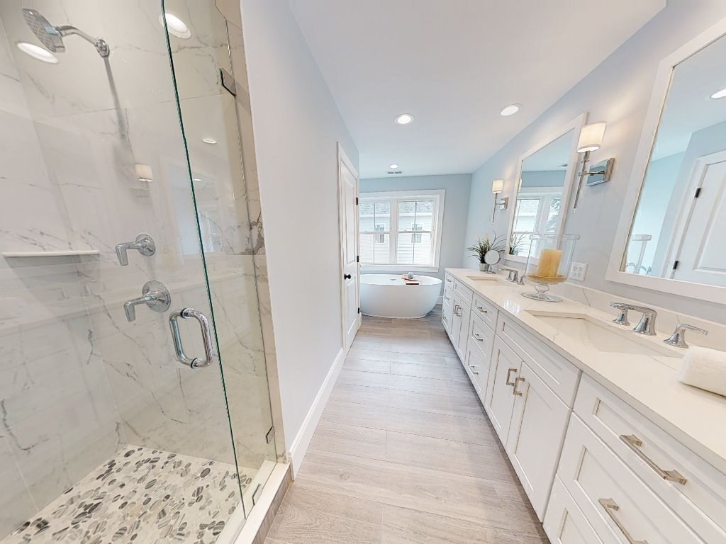 148 Main Street Waltham, MA 02453 - Photo 24 of 42 a bathroom with a sink a toilet a shower and a mirror