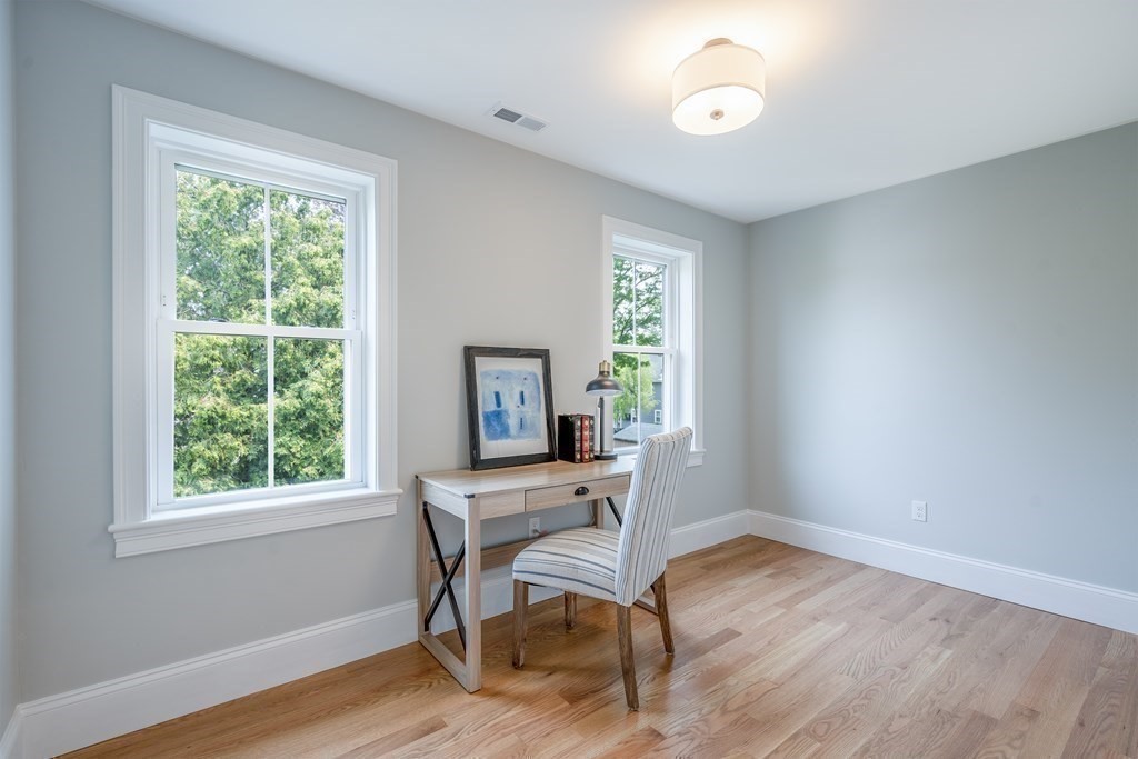 148 Main Street Waltham, MA 02453 - Photo 29 of 42 a workspace with wooden floor and a window