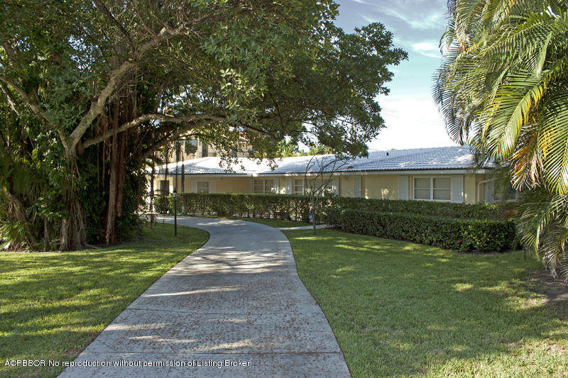 1416 Lands End Road Lantana, FL 33462 - Photo 1 of 21 a front view of a house with a yard and trees