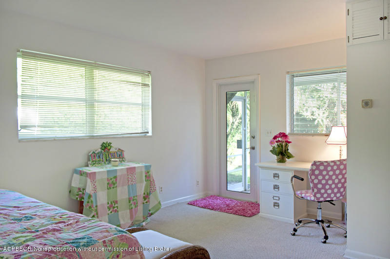 1416 Lands End Road Lantana, FL 33462 - Photo 16 of 21 a bedroom with a bed table chair and a window