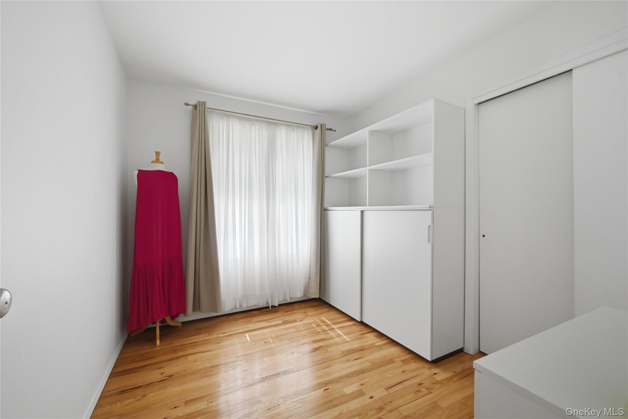 35 Randall Road Shoreham, NY 11786 - Photo 13 of 32 a view of a room with wooden floor and a cabinet