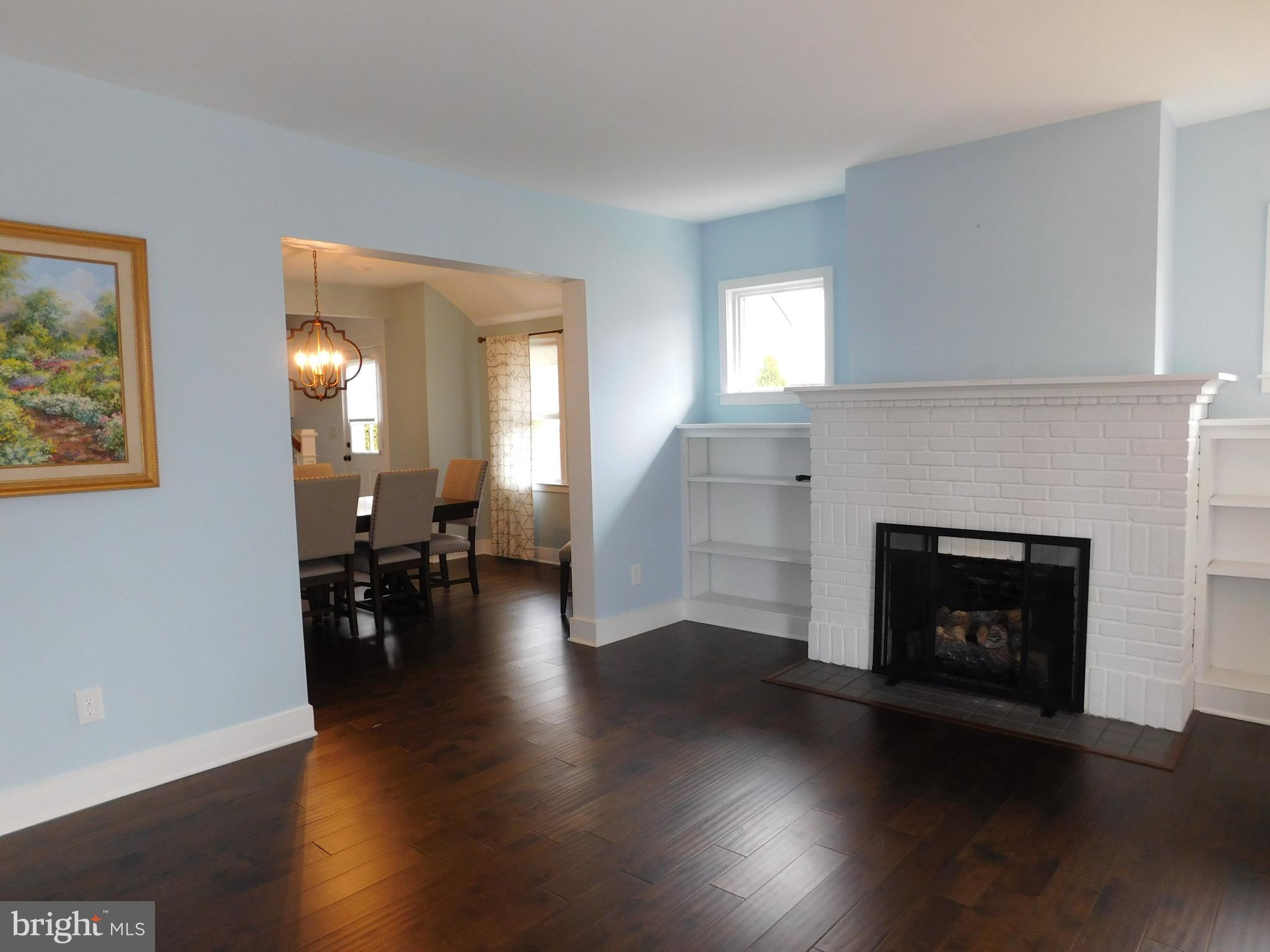234 Crafton Avenue Pitman, NJ 08071 - Photo 11 of 61 a living room with furniture and a fireplace