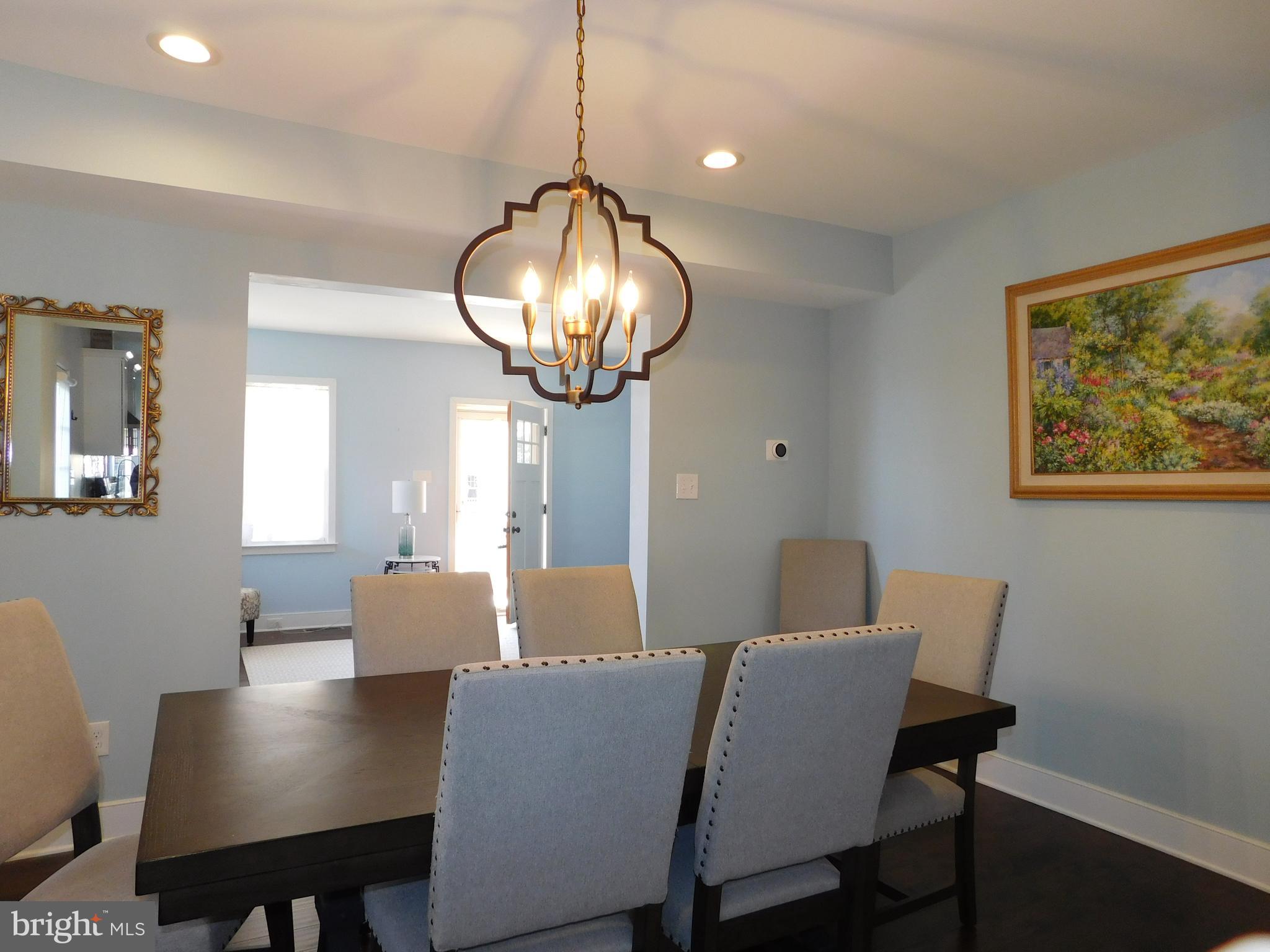 234 Crafton Avenue Pitman, NJ 08071 - Photo 16 of 61 a view of a dining room with furniture wooden floor and chandelier