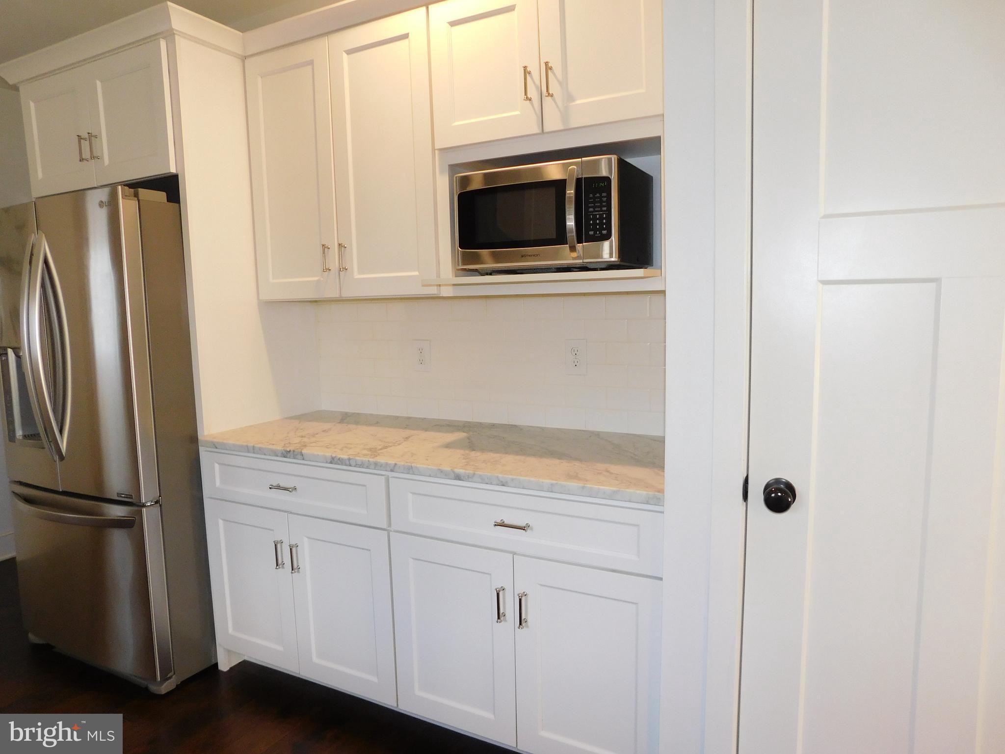 234 Crafton Avenue Pitman, NJ 08071 - Photo 21 of 61 a kitchen with stainless steel appliances granite countertop a refrigerator and microwave
