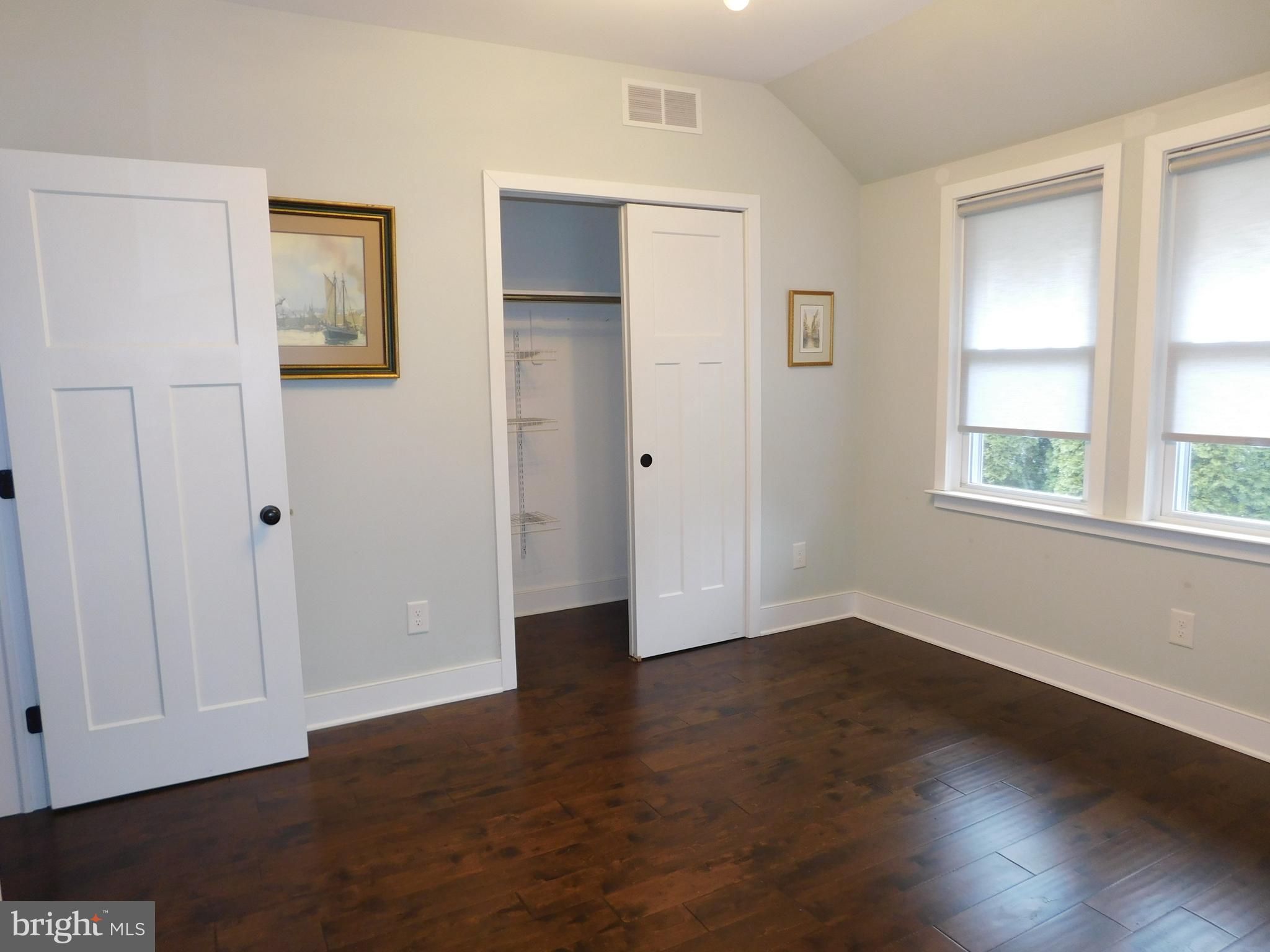 234 Crafton Avenue Pitman, NJ 08071 - Photo 33 of 61 a view of an empty room with wooden floor and a window