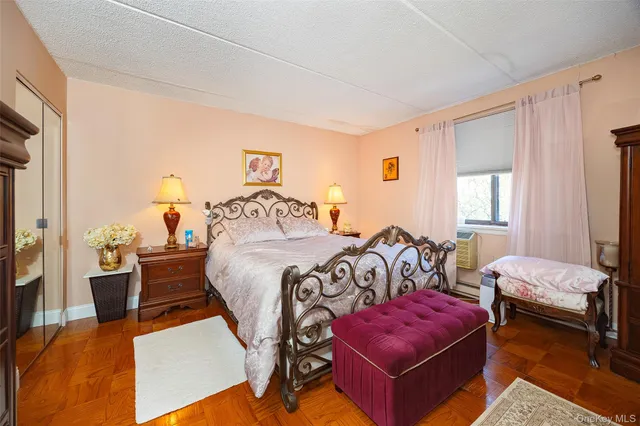 a bedroom with furniture and a dresser