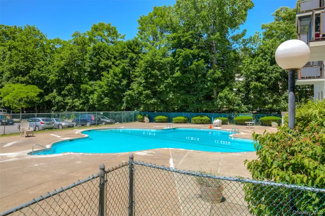 a living room with furniture a rug and a large window