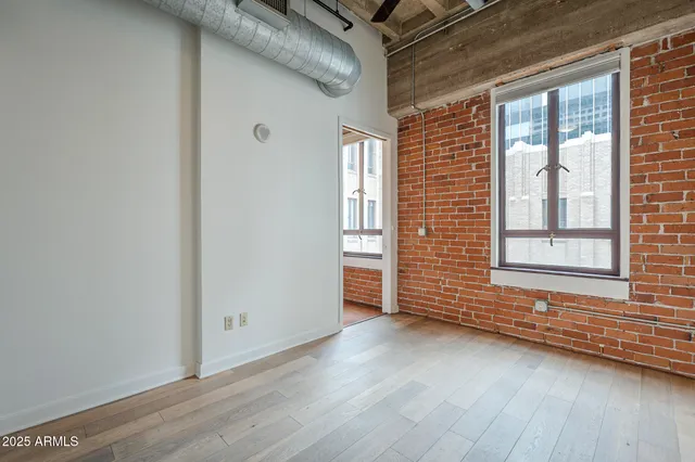 a bedroom with a bed and a mirror