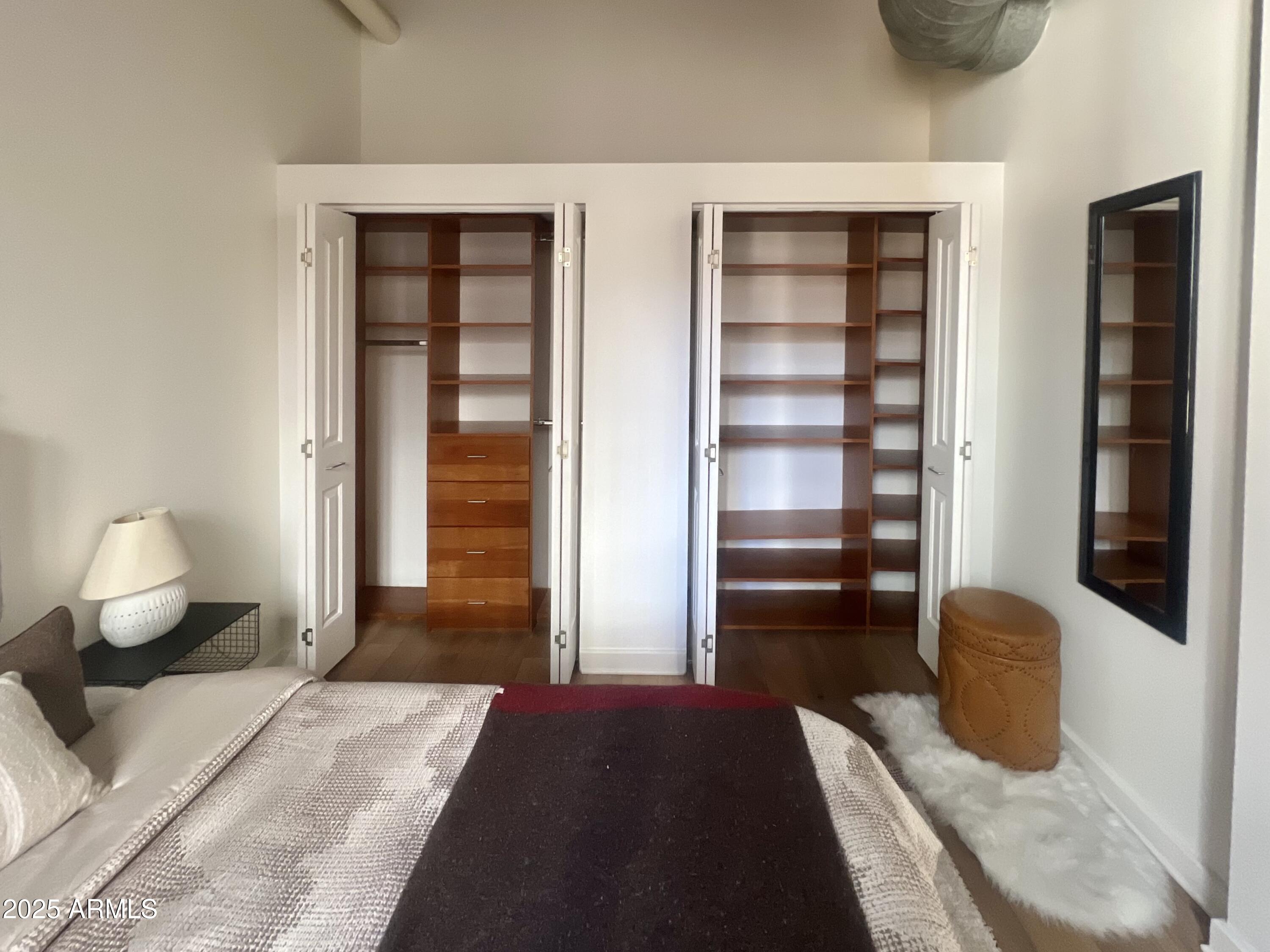 114 West Adams Street, Unit 1007 Phoenix, AZ 85003 - Photo 28 of 51 a bedroom with furniture and a window