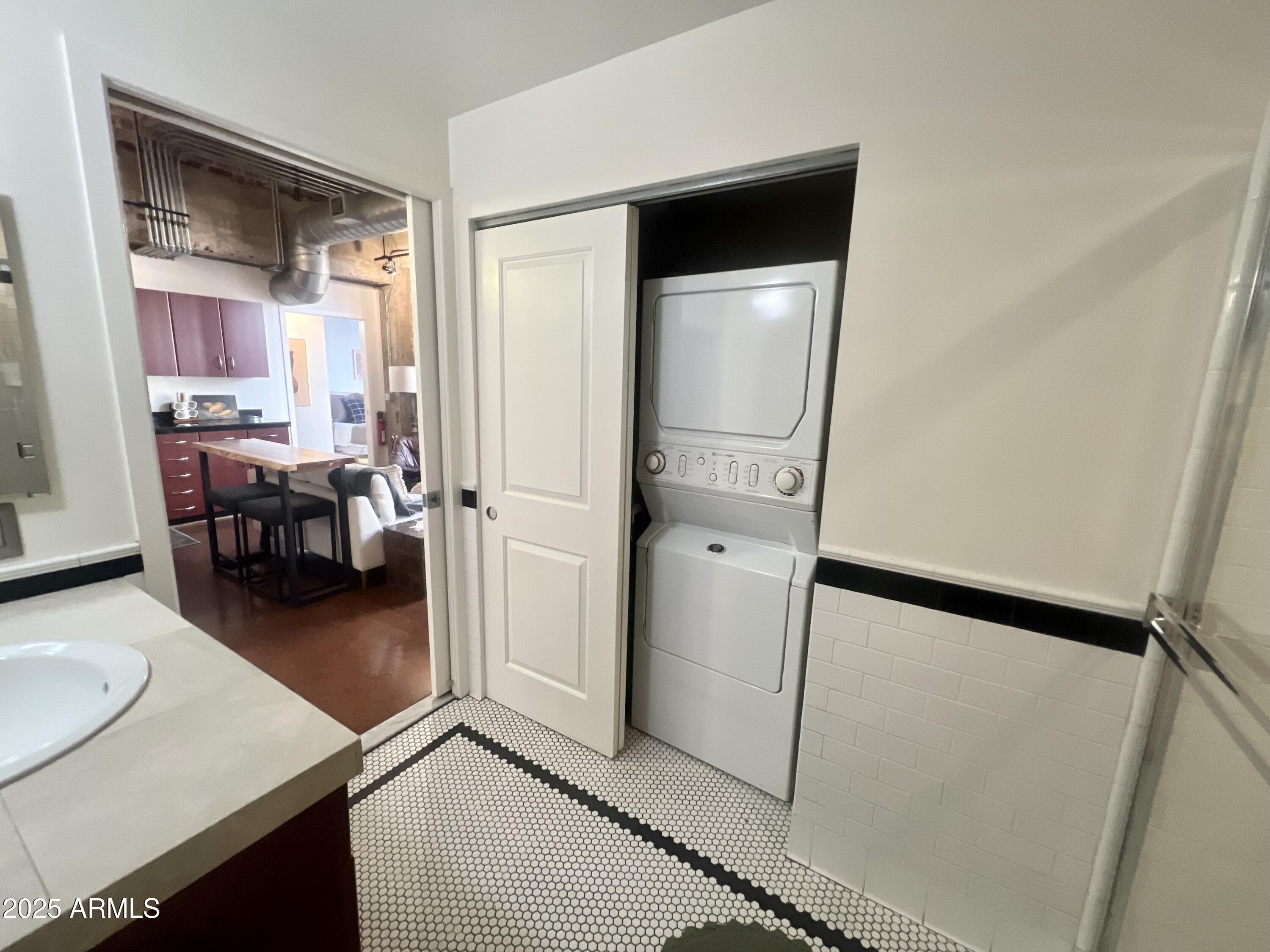 114 West Adams Street, Unit 1007 Phoenix, AZ 85003 - Photo 31 of 51 a view of a livingroom with furniture and front door