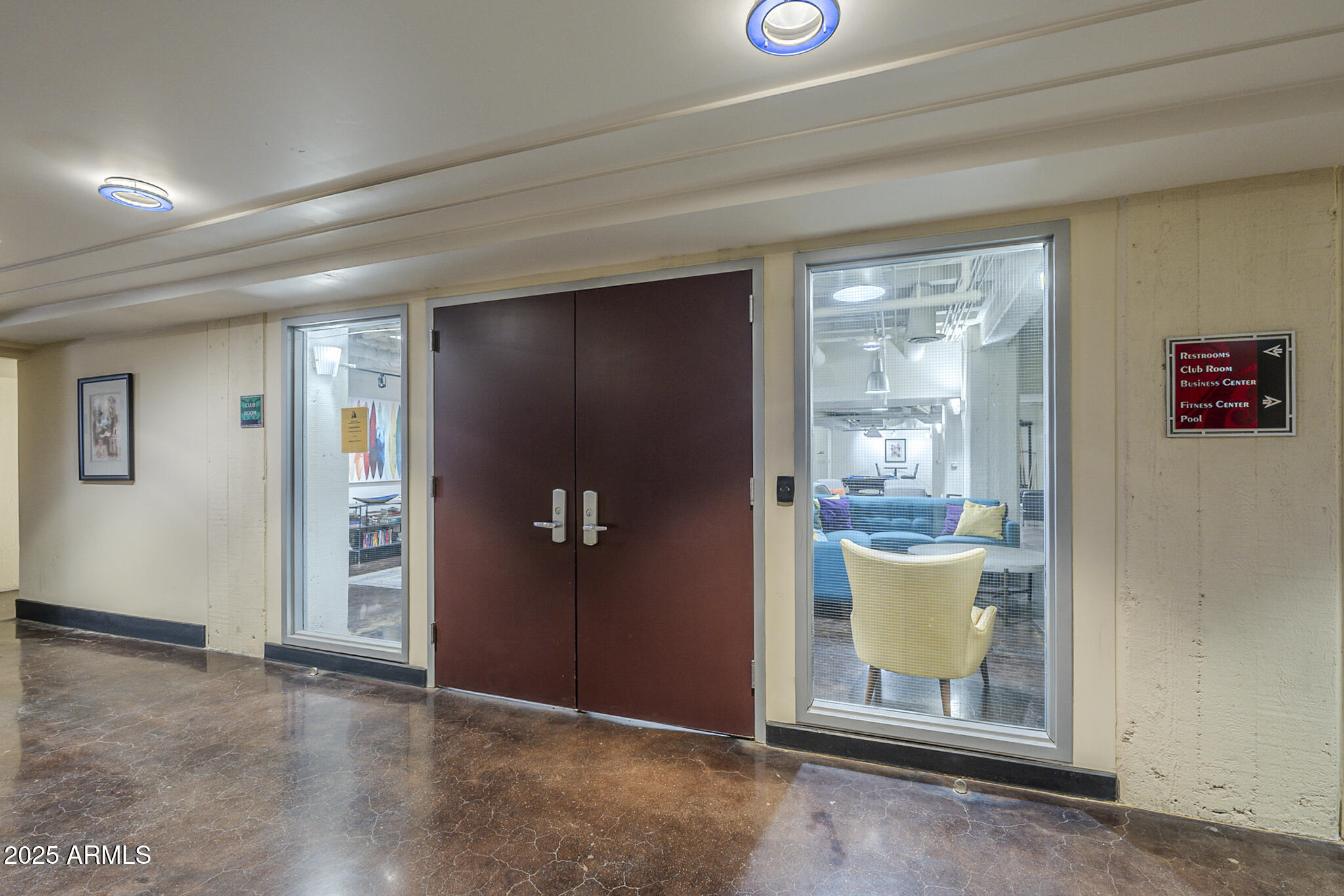 114 West Adams Street, Unit 1007 Phoenix, AZ 85003 - Photo 39 of 51 an empty room with wooden floor mirror and windows