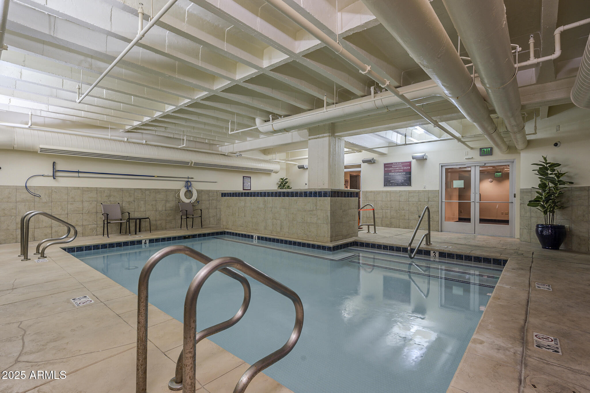 114 West Adams Street, Unit 1007 Phoenix, AZ 85003 - Photo 41 of 51 a kitchen with stainless steel appliances granite countertop lots of counter top space