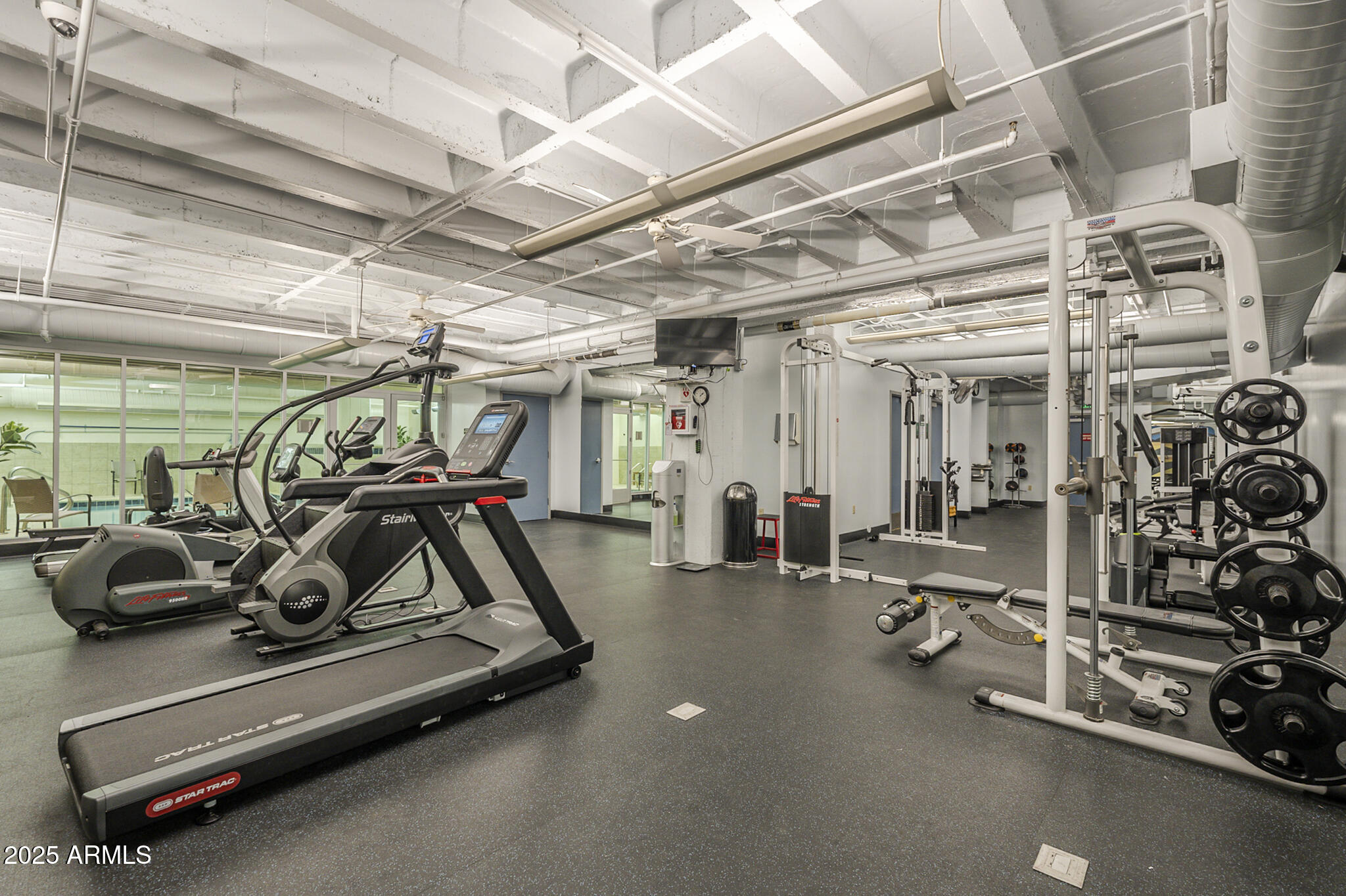 114 West Adams Street, Unit 1007 Phoenix, AZ 85003 - Photo 44 of 51 a view of a room with gym equipment