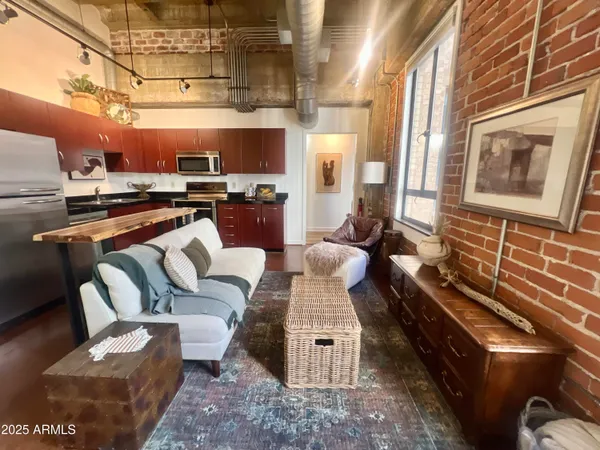 a living room with furniture and a fireplace