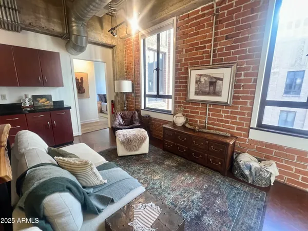 a living room with furniture and a rug