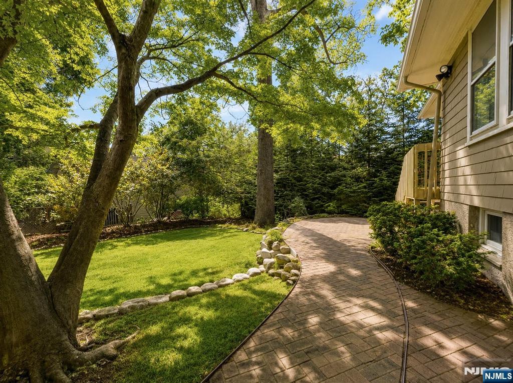 84 Valley View Avenue Ridgewood, NJ 07450 - Photo 19 of 20 a view of a yard with plants and trees