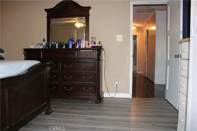 a room with a dresser and a mirror