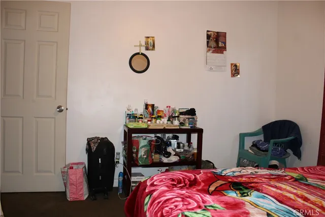 a bedroom with a bed and a table