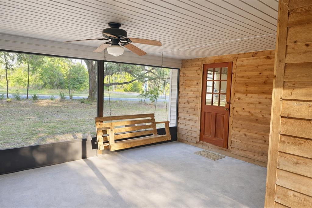 10019 Curley Road San Antonio, FL 33576 - Photo 8 of 10 wooden floor in an empty room with a window