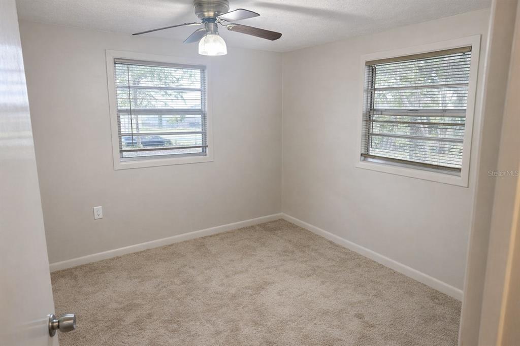 10019 Curley Road San Antonio, FL 33576 - Photo 9 of 10 an empty room with a window