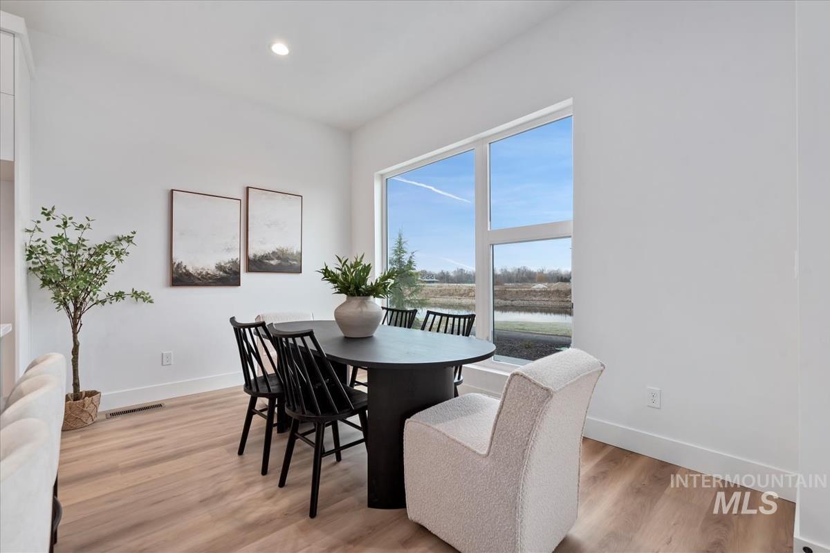 735 South Calhoun Lane Star, ID 83669 - Photo 12 of 47 Dining area featuring light wood-type flooring and recessed lighting
