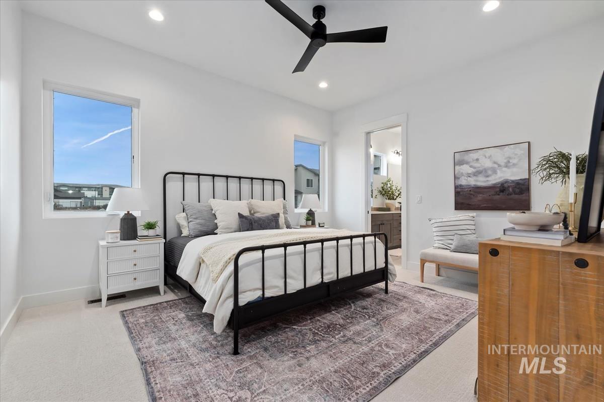 735 South Calhoun Lane Star, ID 83669 - Photo 20 of 47 Bedroom featuring ceiling fan, light carpet, connected bathroom, and recessed lighting