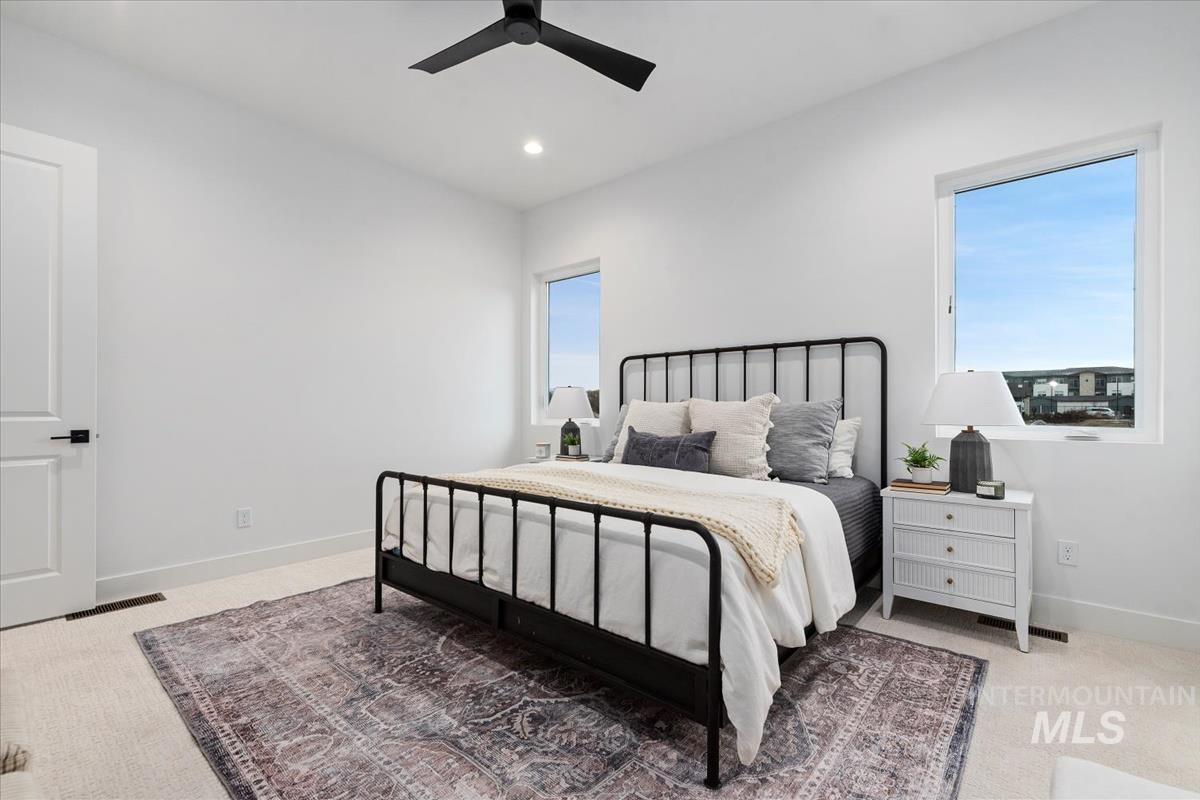 735 South Calhoun Lane Star, ID 83669 - Photo 21 of 47 Bedroom with light carpet, a ceiling fan, and recessed lighting