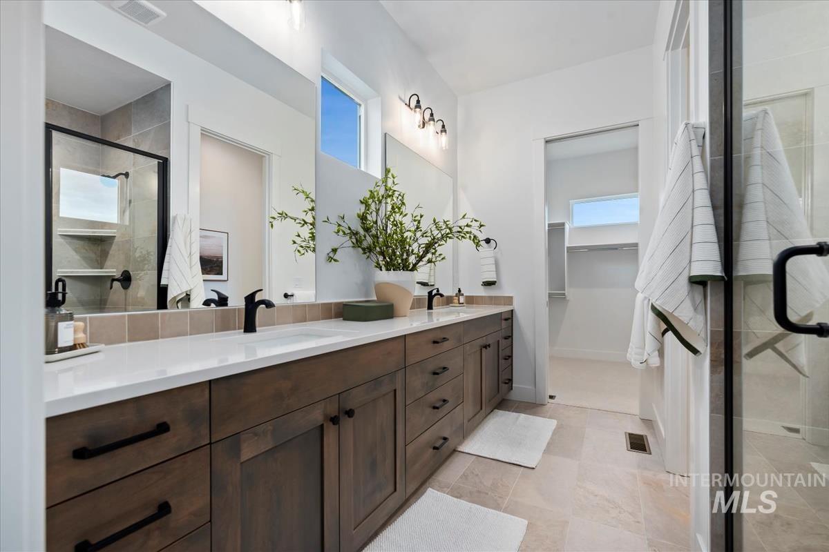 735 South Calhoun Lane Star, ID 83669 - Photo 23 of 47 Full bath featuring double vanity, a stall shower, and a walk in closet