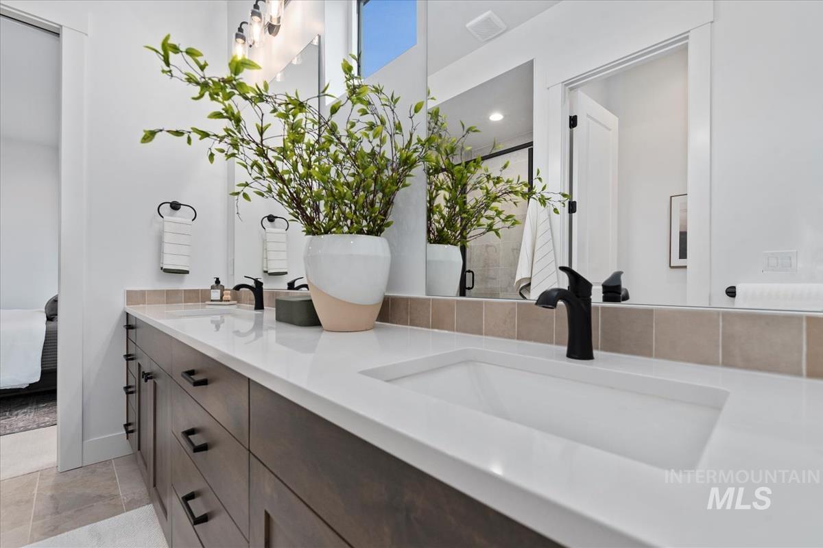 735 South Calhoun Lane Star, ID 83669 - Photo 25 of 47 Ensuite bathroom featuring double vanity and a stall shower