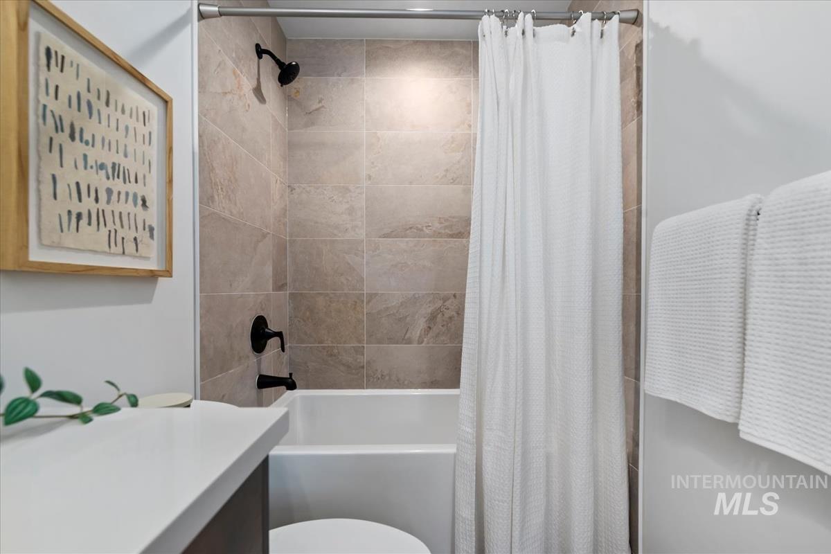 735 South Calhoun Lane Star, ID 83669 - Photo 32 of 47 Bathroom featuring shower / bath combo with shower curtain and vanity
