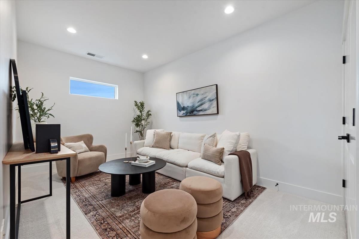735 South Calhoun Lane Star, ID 83669 - Photo 36 of 47 Carpeted living area featuring baseboards and recessed lighting