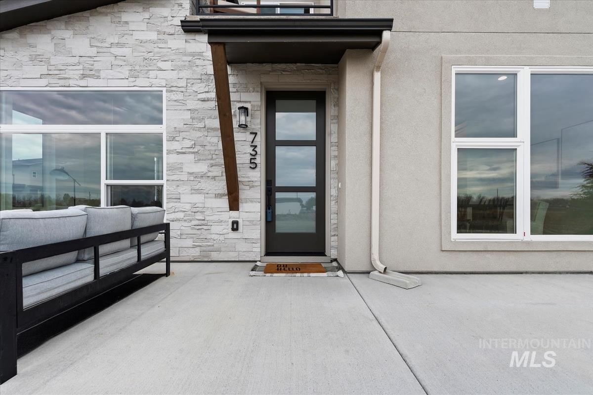 735 South Calhoun Lane Star, ID 83669 - Photo 4 of 47 Entrance to property featuring stone siding and stucco siding