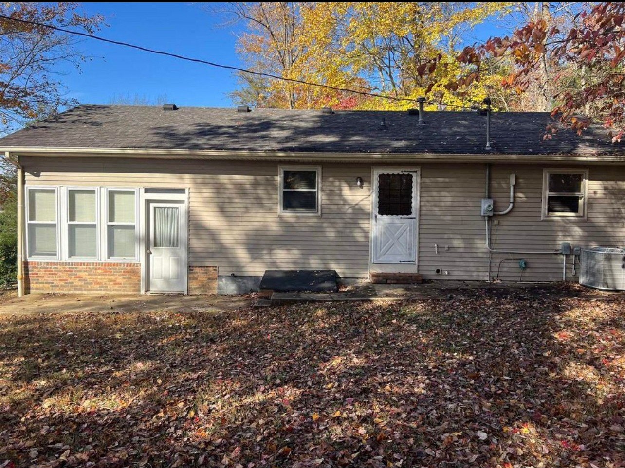6938 Highway 973 Dunmor, KY 42339 - Photo 2 of 7 a backyard of a house