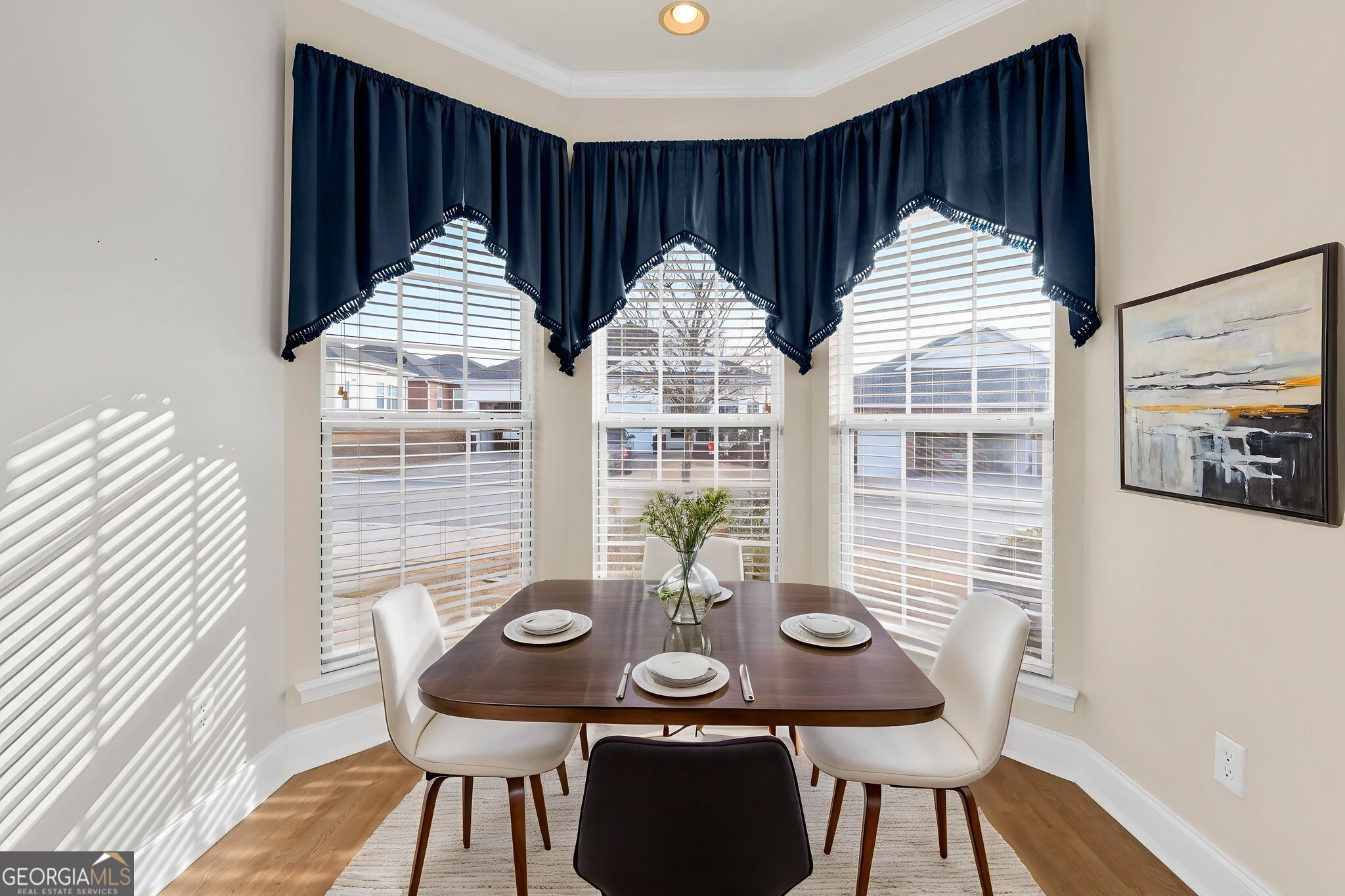 310 Pebble Beach Drive Perry, GA 31069 - Photo 12 of 42 a view of a dining room with furniture and wooden floor