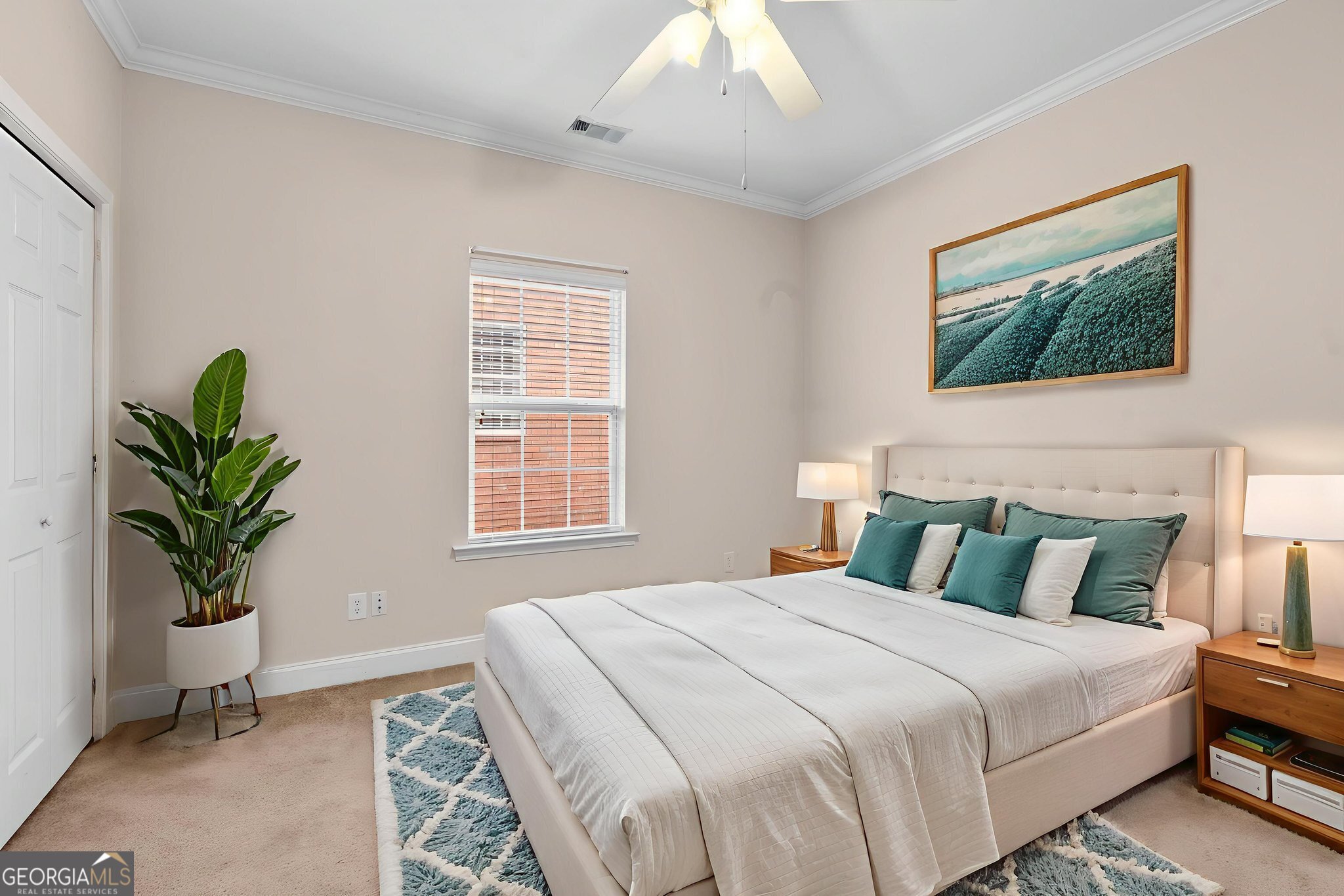 310 Pebble Beach Drive Perry, GA 31069 - Photo 16 of 42 a bedroom with bed and a potted plant