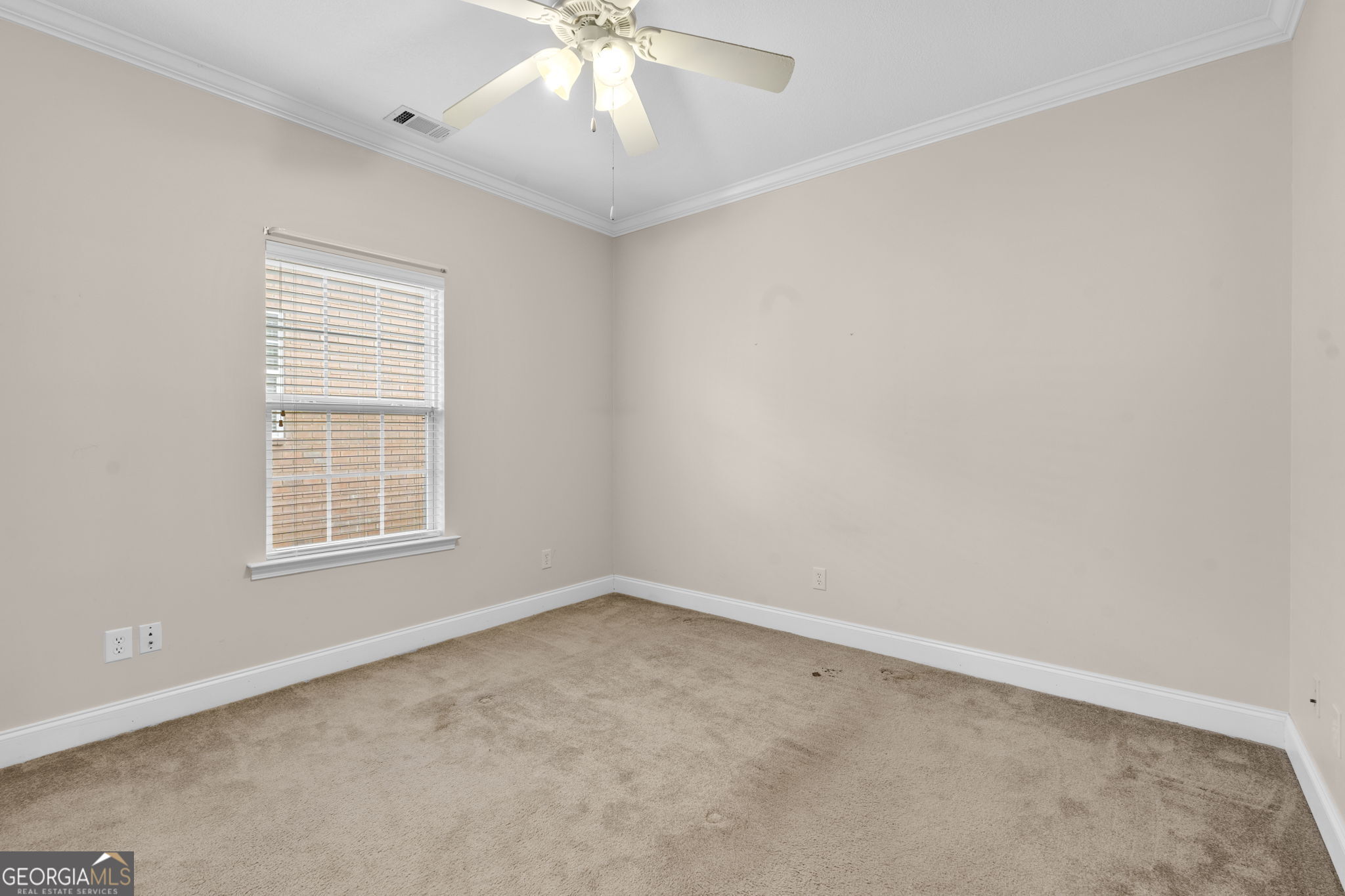 310 Pebble Beach Drive Perry, GA 31069 - Photo 17 of 42 an empty room with a window