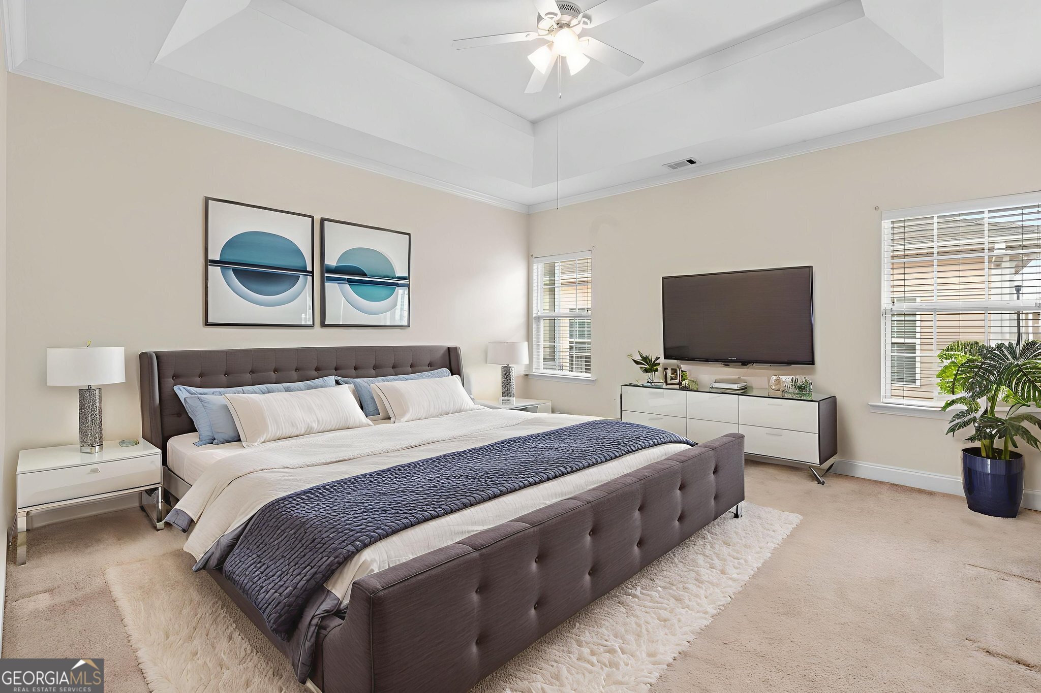 310 Pebble Beach Drive Perry, GA 31069 - Photo 19 of 42 a spacious bedroom with a bed and a flat screen tv