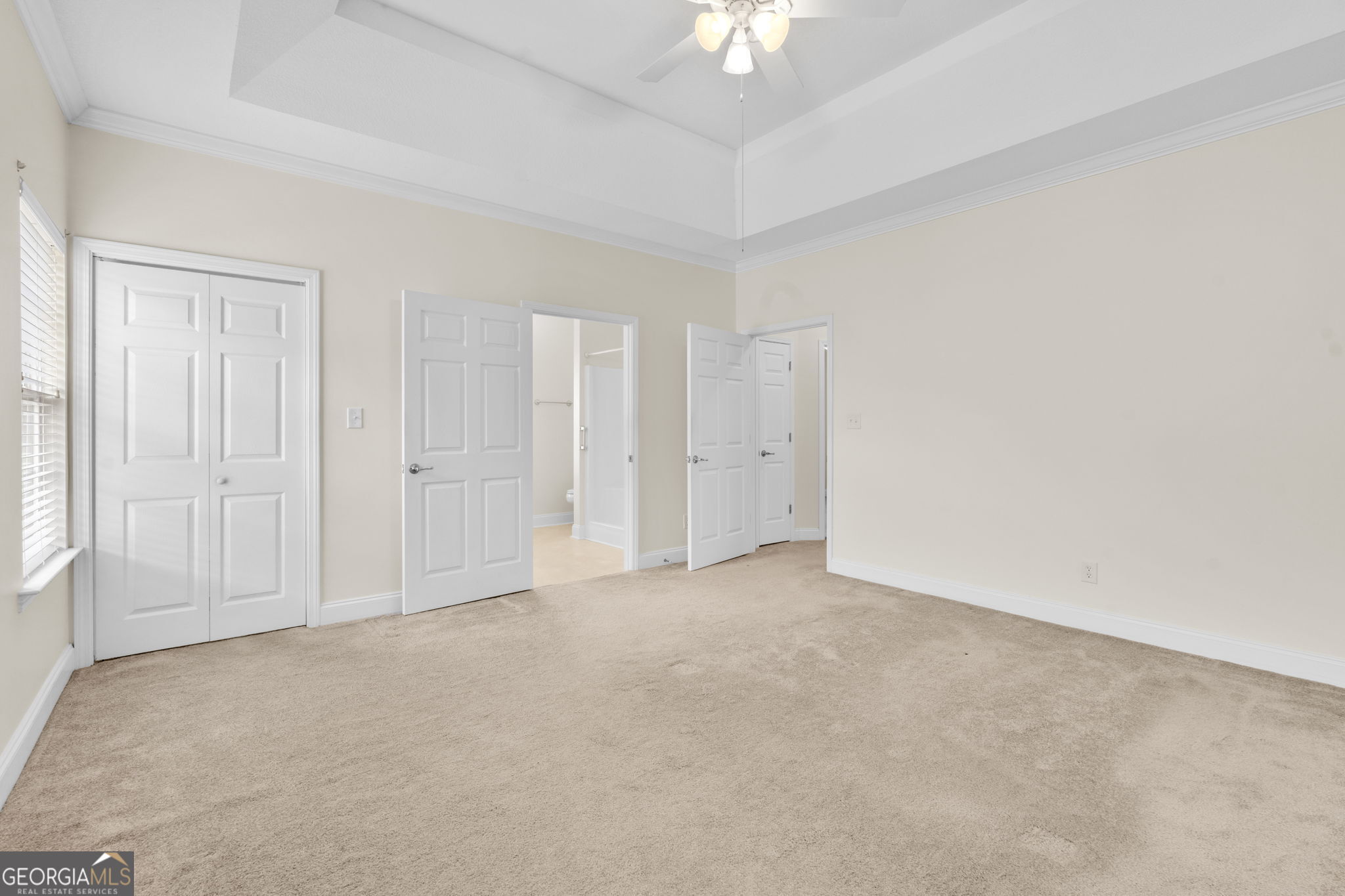 310 Pebble Beach Drive Perry, GA 31069 - Photo 20 of 42 an empty room with chandelier fan