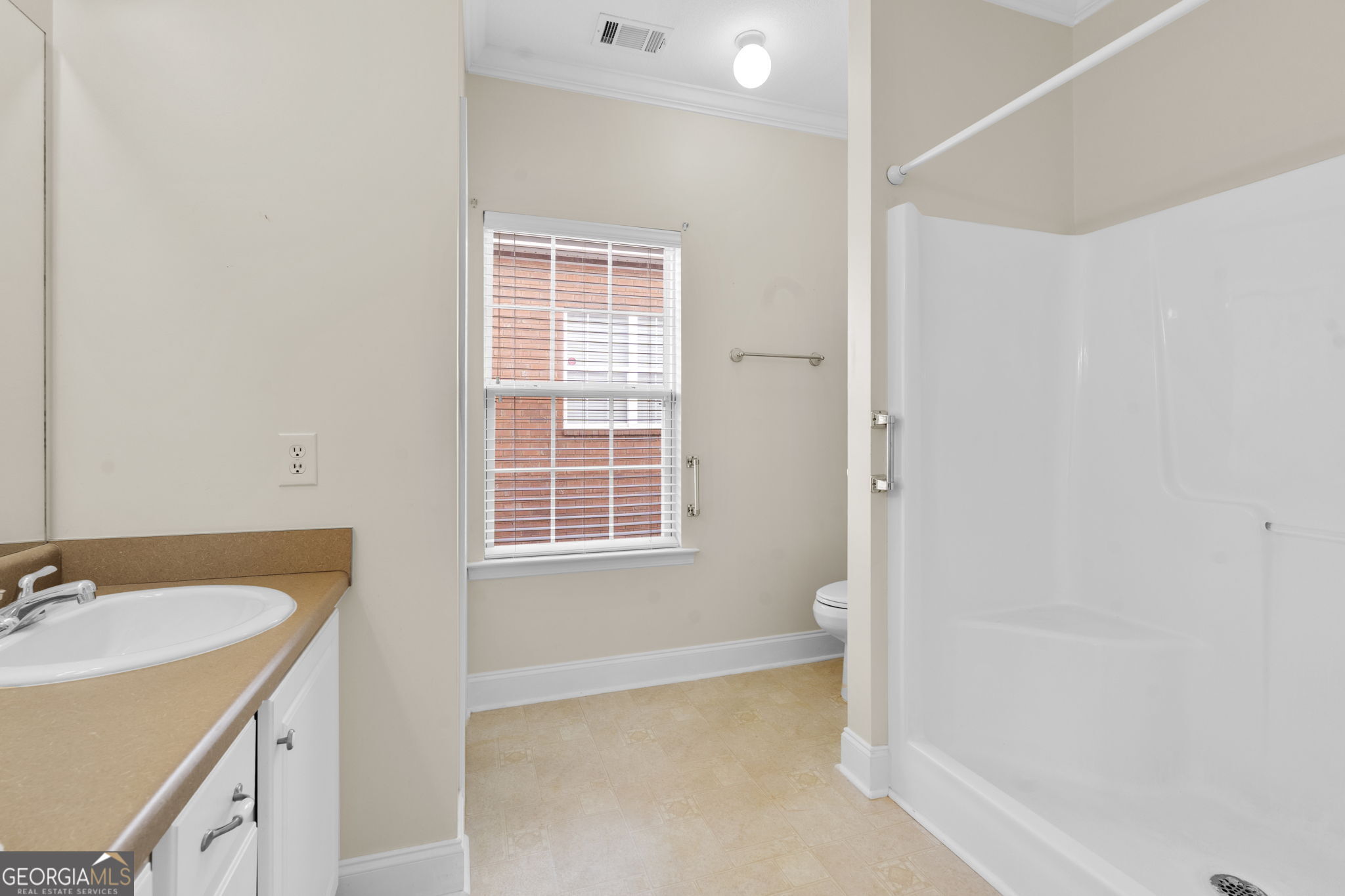 310 Pebble Beach Drive Perry, GA 31069 - Photo 24 of 42 a bathroom with a sink a bathtub and a sink