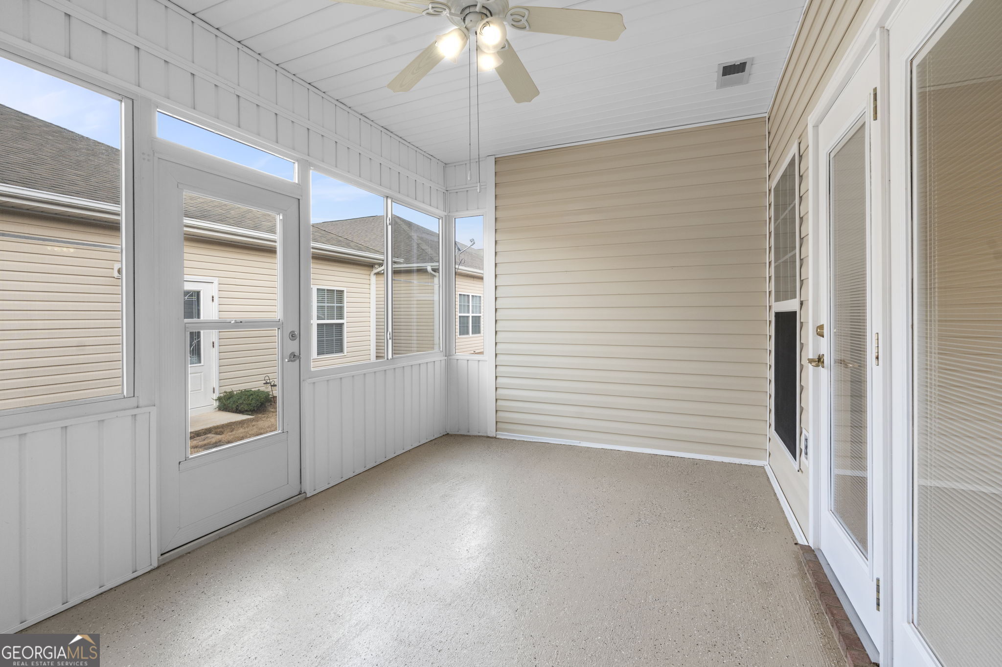 310 Pebble Beach Drive Perry, GA 31069 - Photo 37 of 42 wooden floor in an empty room with a window