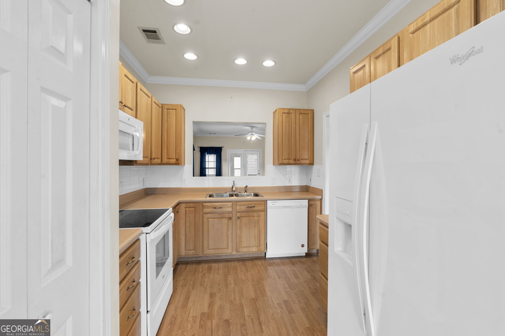 310 Pebble Beach Drive Perry, GA 31069 - Photo 6 of 42 a kitchen with stainless steel appliances granite countertop a sink and cabinets