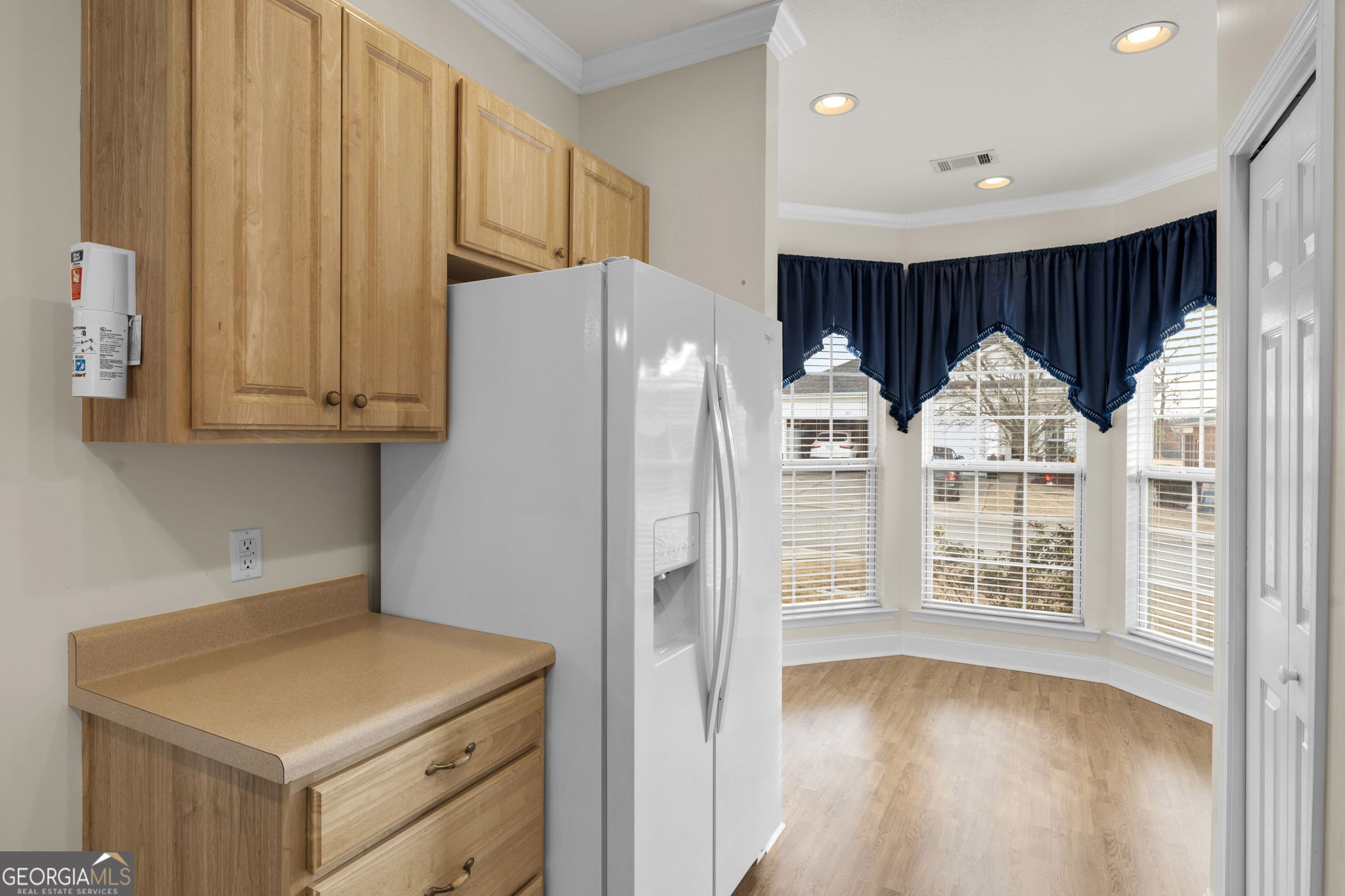 310 Pebble Beach Drive Perry, GA 31069 - Photo 10 of 42 a kitchen with stainless steel appliances a refrigerator and a more cabinets