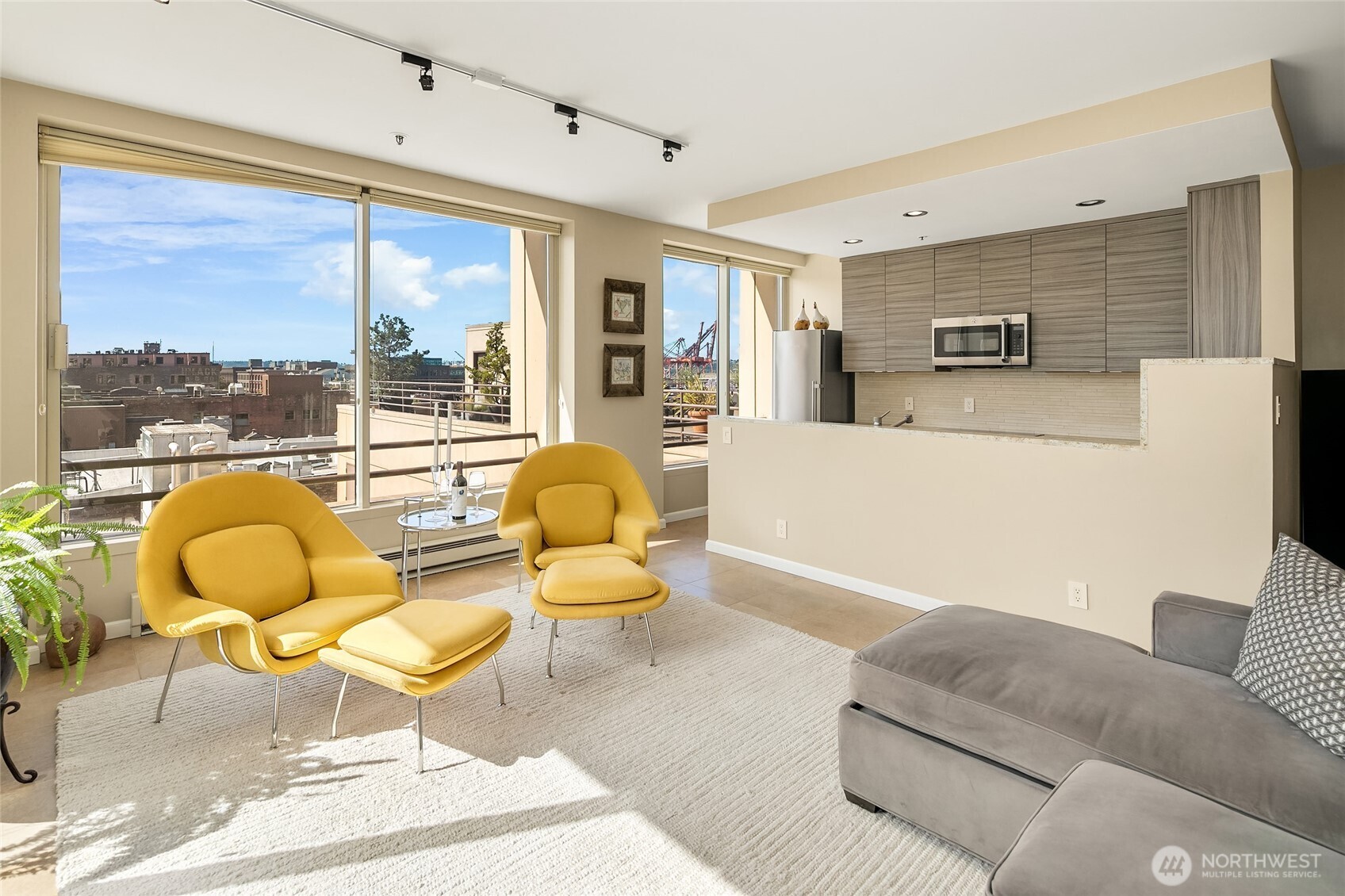100 1st Avenue South, Unit 8 Seattle, WA 98104 - Photo 7 of 29 a living room with furniture and a large window