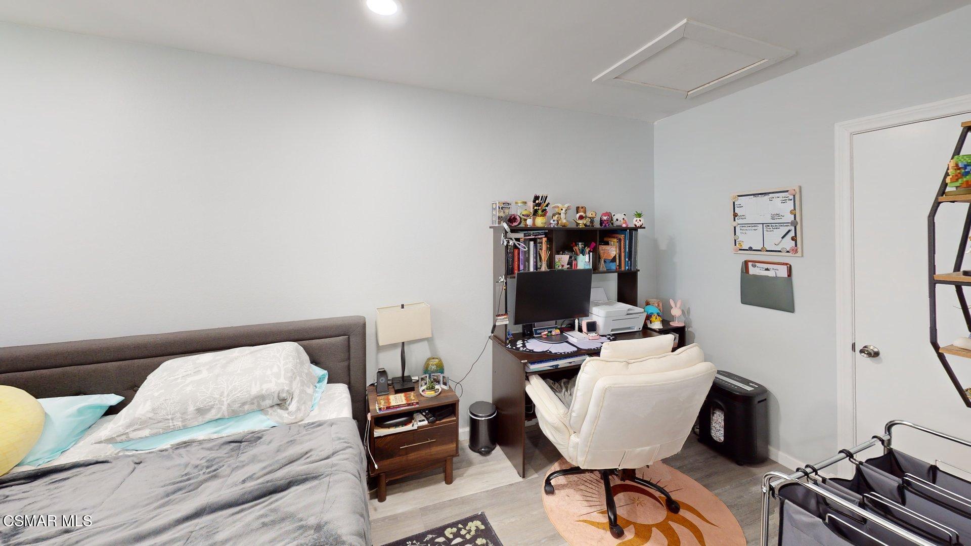 3075 Kelp Lane Oxnard, CA 93035 - Photo 15 of 22 a bedroom with a bed and wooden floor