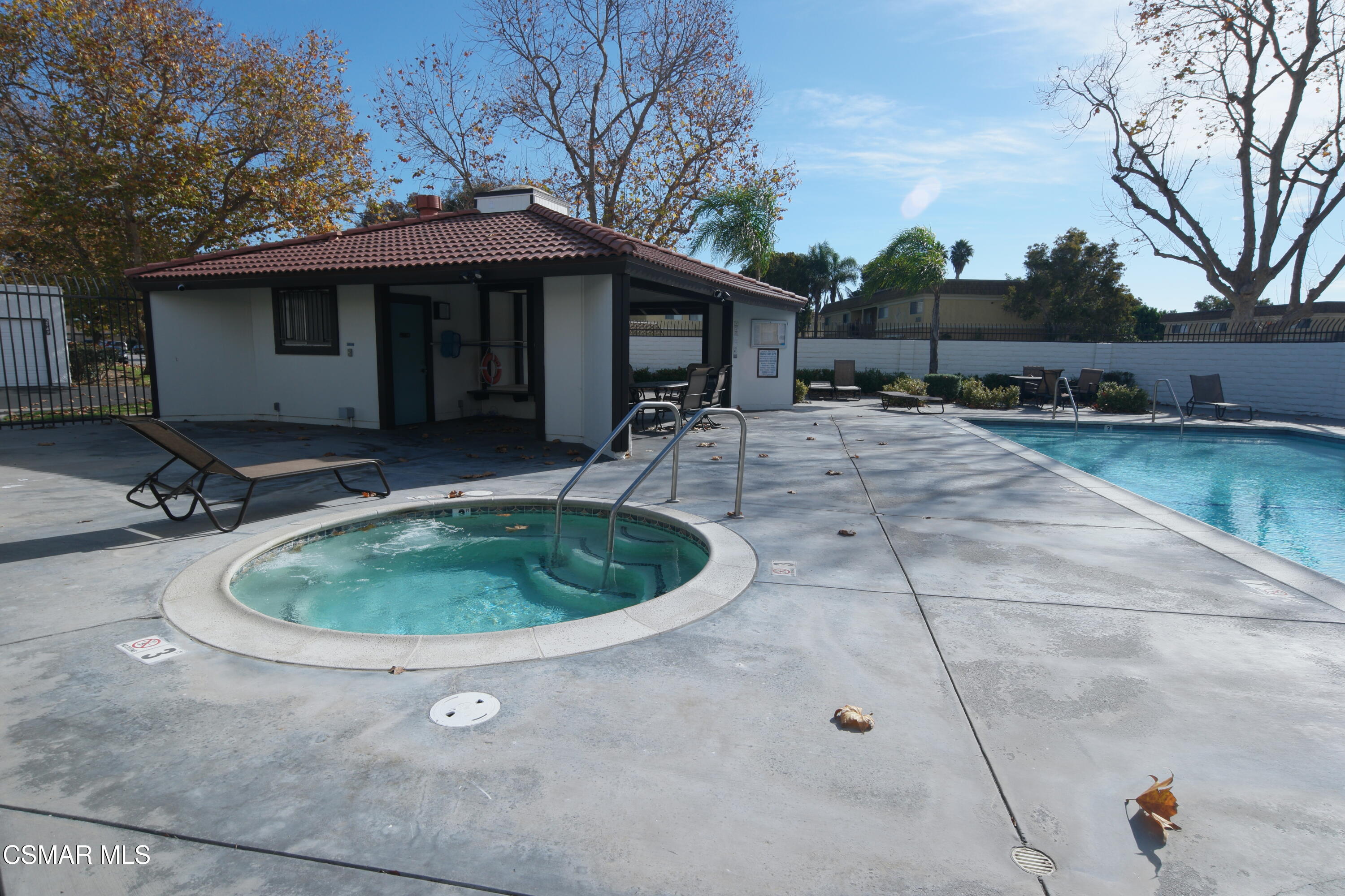 3075 Kelp Lane Oxnard, CA 93035 - Photo 22 of 22 a view of a backyard with table and chairs under an umbrella