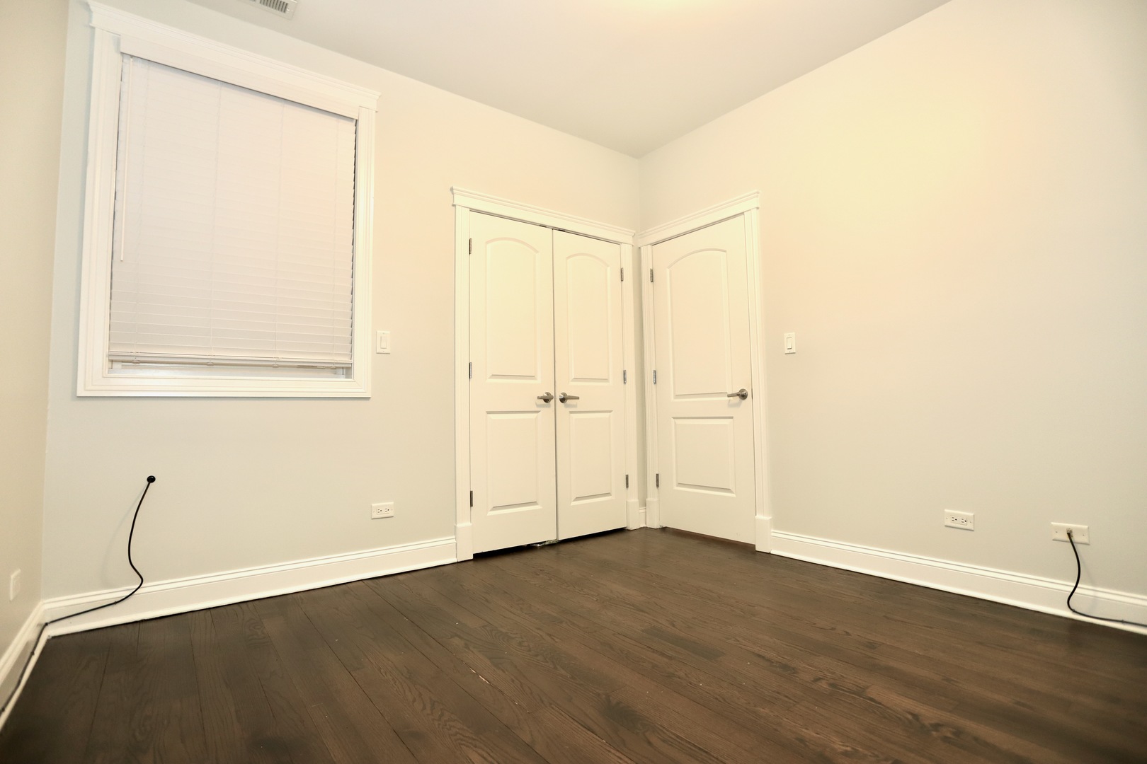 39 North Morgan Street, Unit 3 Chicago, IL 60607 - Photo 13 of 17 an empty room with wooden floor and windows