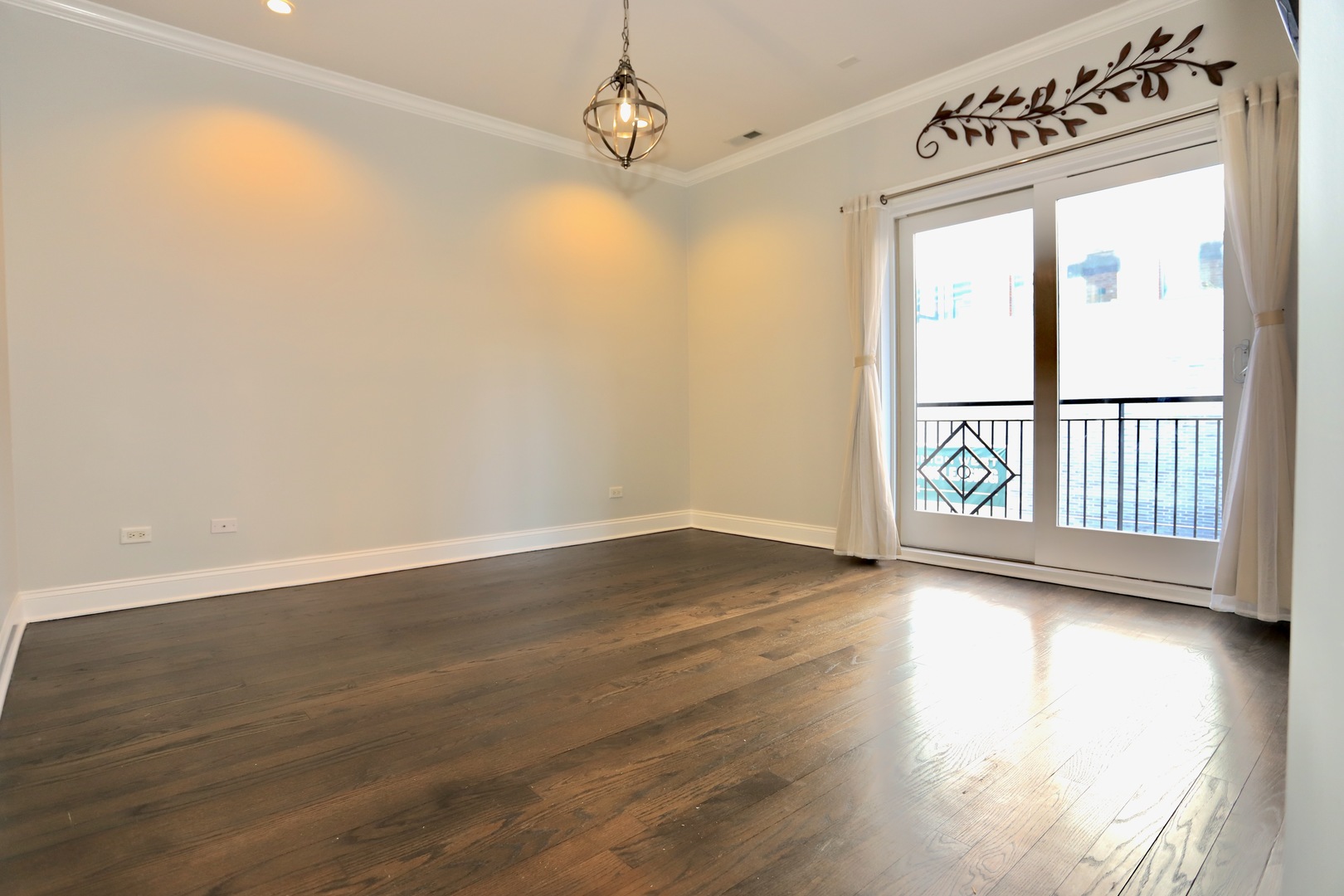 39 North Morgan Street, Unit 3 Chicago, IL 60607 - Photo 14 of 17 a view of a hallway with wooden floor and a window