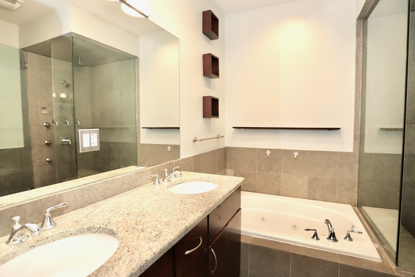 39 North Morgan Street, Unit 3 Chicago, IL 60607 - Photo 15 of 17 a bathroom with a granite countertop sink and a bathtub