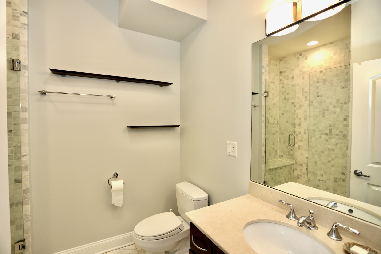39 North Morgan Street, Unit 3 Chicago, IL 60607 - Photo 16 of 17 a bathroom with a sink toilet and shower